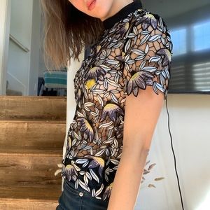 Beautiful see through embroidered t shirt.